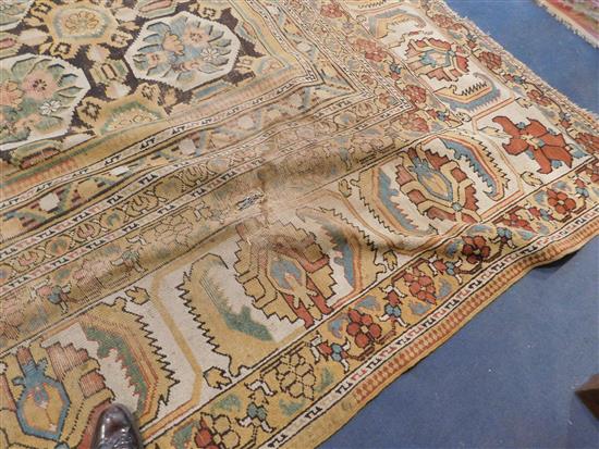 A large Indian carpet, circa 1910, 16ft 1in x 21ft 4in. (652cm x 491cm), fragment 5ft 11in. x 3ft 6in.